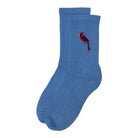 A pair of blue crew socks with a small red cardinal bird graphic on the upper leg, shown against a plain white background.