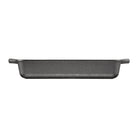 Side profile of black rectangular cast iron baking dish with handles on a white background