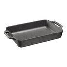 Black rectangular cast iron baking dish with handles on a white background