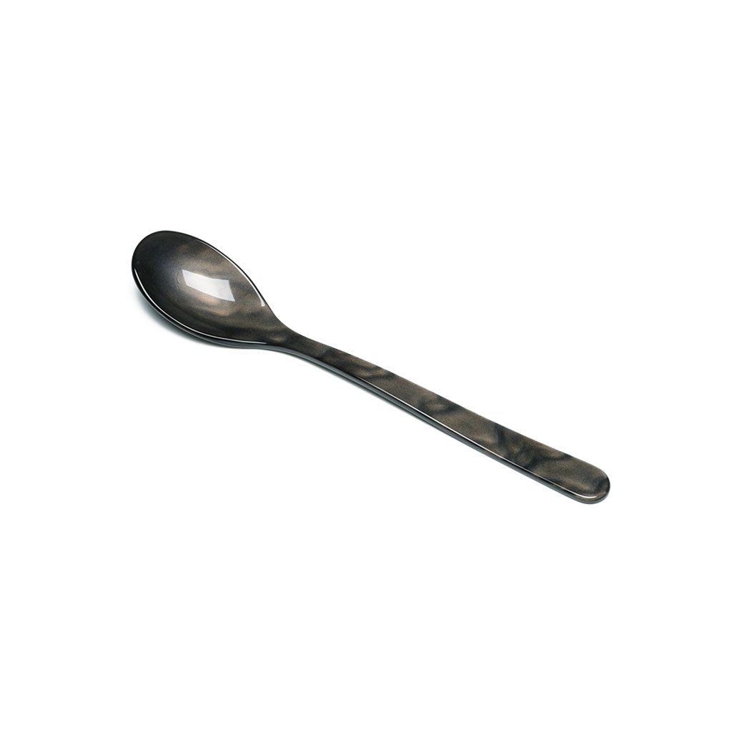 A grayish brown cereal spoon on a white background.