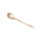 Cream colored acrylic cereal spoon on white background