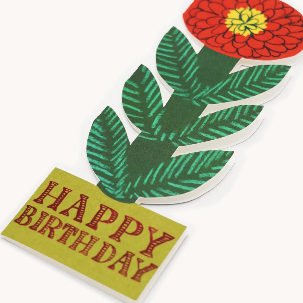 Red flower standing happy birthday card on light background