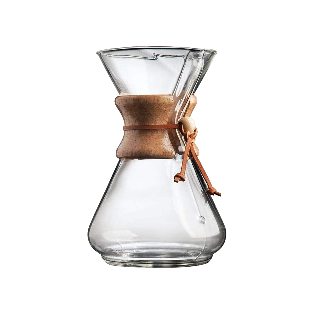 A Chemex coffee maker with a clear glass conical chamber, a natural wood collar, and a brown leather tie, shown on a solid white background.
