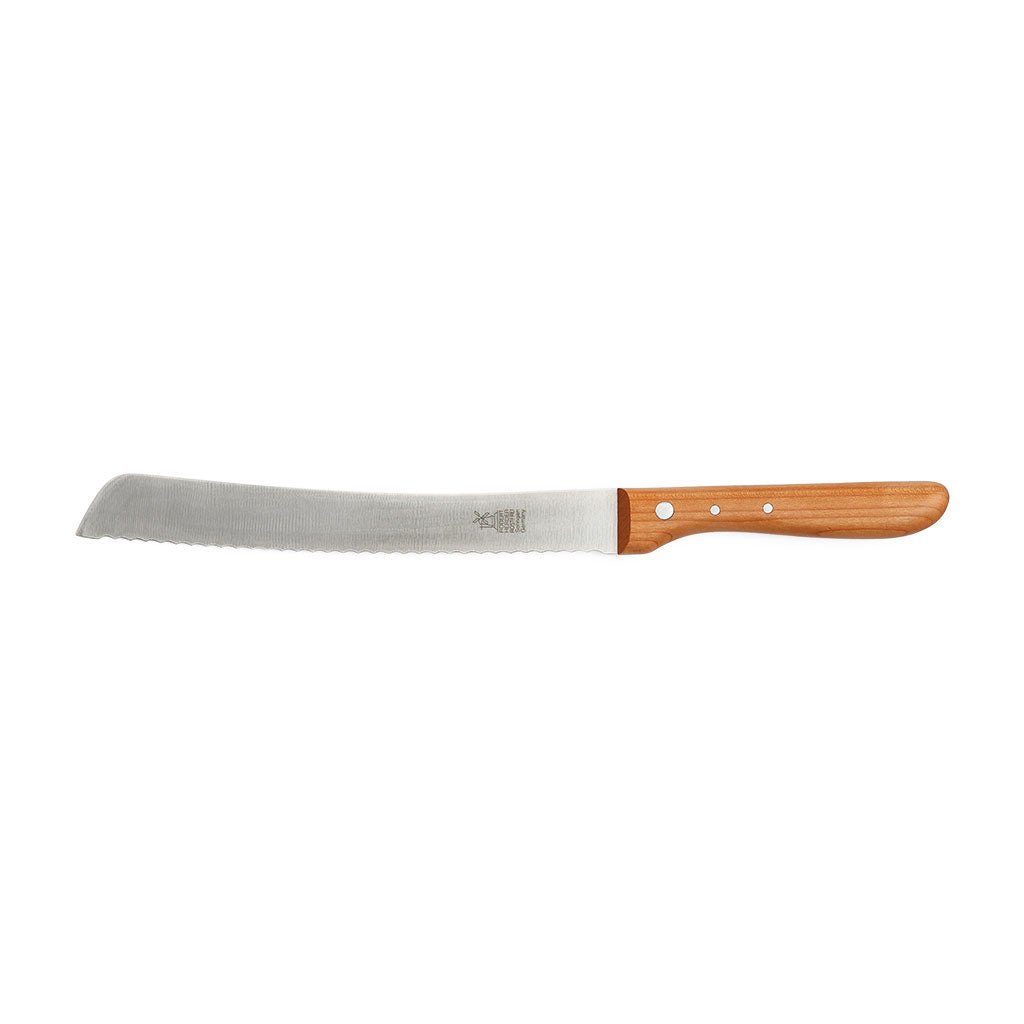 Stainless steel serrated cherrywood bread knife on white background