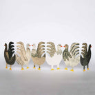 Unfolded decorative chicken concertina card in various colors on a light gray background