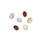 Six chocolate eggs with speckled shells. 
