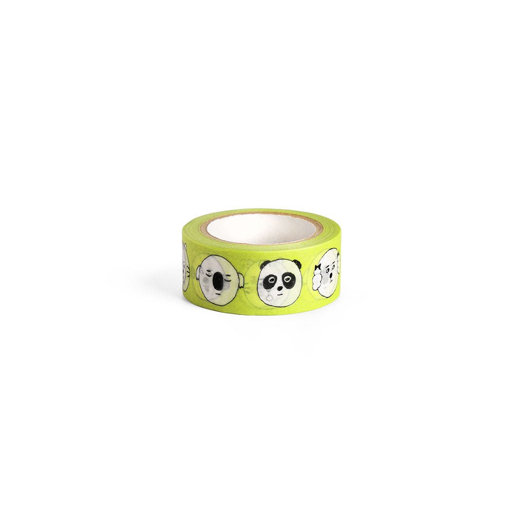 Yellow green washi tape with black and white cartoon animal faces.