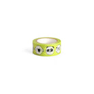 Yellow green washi tape with black and white cartoon animal faces.
