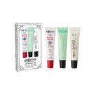Gift set of three lip balm tubes next to packaging.