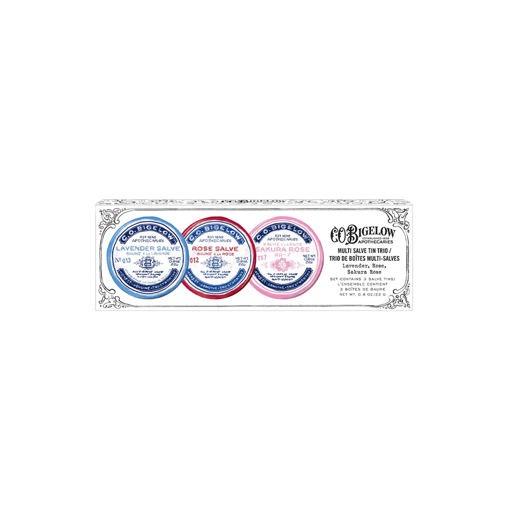Front view of boxed set of three lip salve tins on white background.