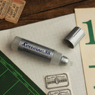 Close up of Coccoina 81 liquid glue rubber applicator 