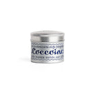 Tin of Coccoina adhesive paste on white background