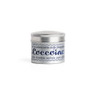 Tin of Coccoina adhesive paste on white background