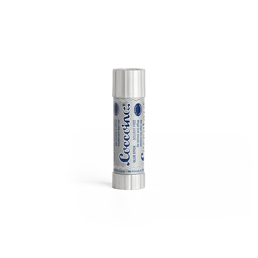 Silver and navy tube of Coccoina Adhesive on a white background