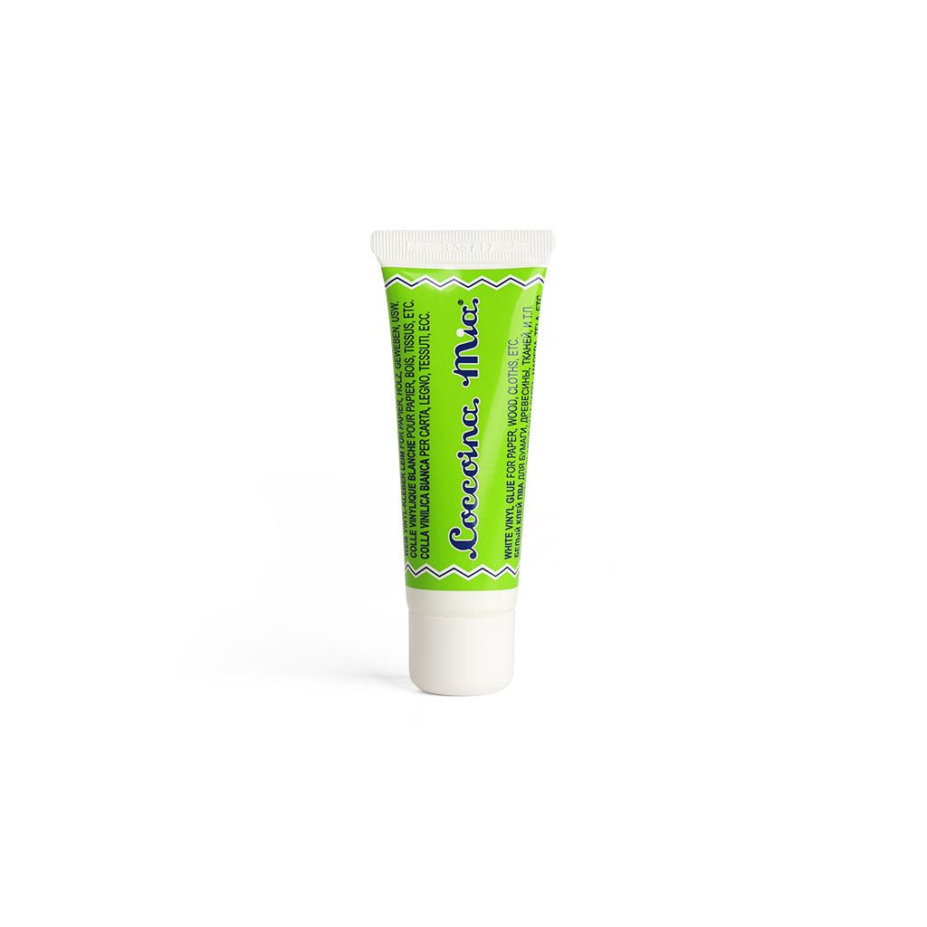 Green tube of Coccoina Mia White Vinyl Glue Adhesive on white background