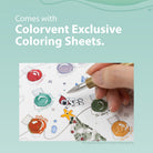 Photo of hand using dip pen to color ink ink swatching pages with holiday theme on blue graphic for Colorvent Colorverse Ink Advent Calendar