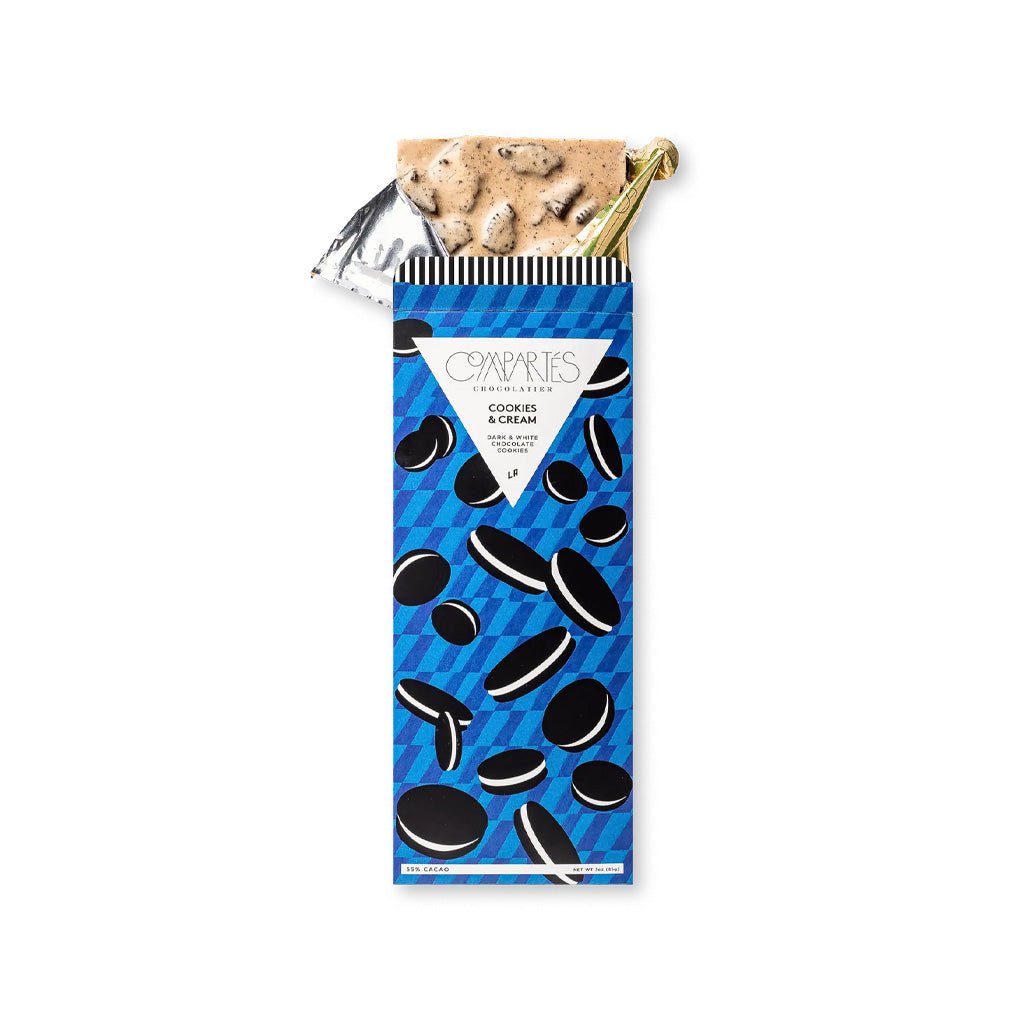 A packaged Cookies & Cream chocolate bar with gold foil wrapping open.