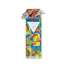 Croissant chocolate bar in gold foil and colorful packaging.