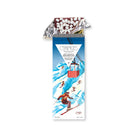 Hot cocoa & marshmallow chocolate bar open in gold foil and ski-themed packaging.