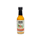 A bottle of Craic Sauce Brian Boru Curry hot sauce on a plain white background.