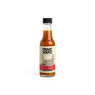 A bottle of Craic Sauce Mill City Red hot sauce.