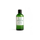 Green bottle of almond oil by D. R. Harris on white background