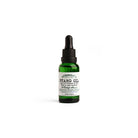 Green bottle of D. R. Harris beard oil on white background