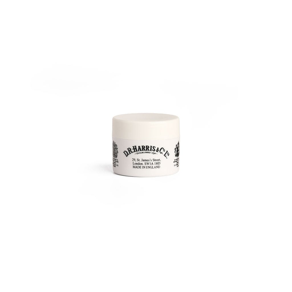 Jar of D.R. Harris lip balm on white background