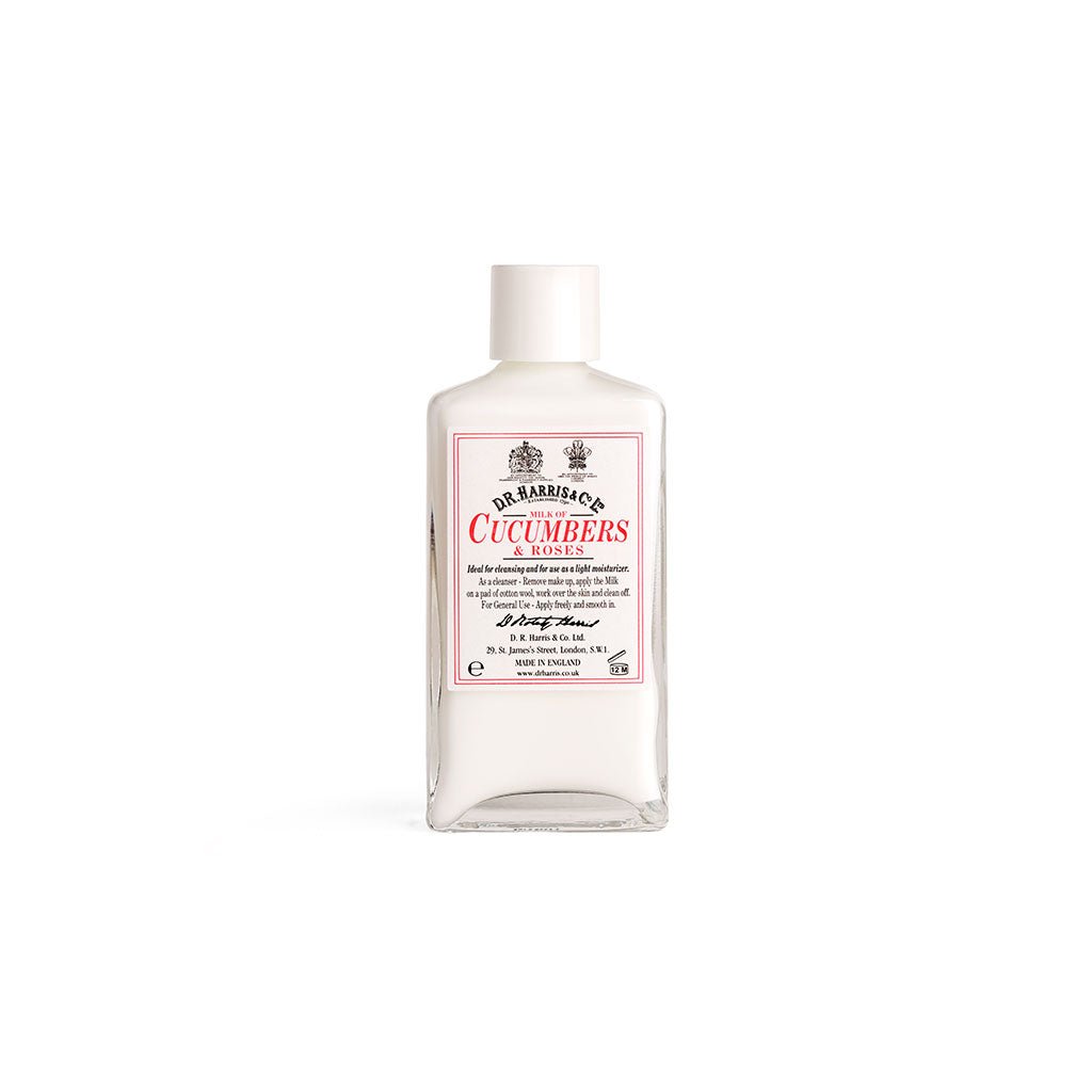 Bottle of D. R. Harris milk of cucumber and roses with white cap on white background
