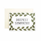 Greeting card with text “deepest sympathy” framed by a green leafy border, shown with a cream envelope.
