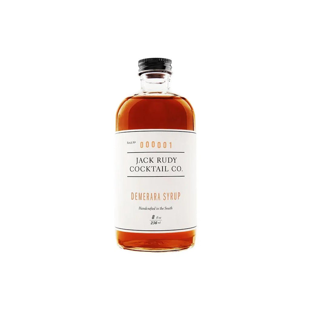 Bottle of Jack Rudy Cocktail Co. Demerara Syrup on a white background