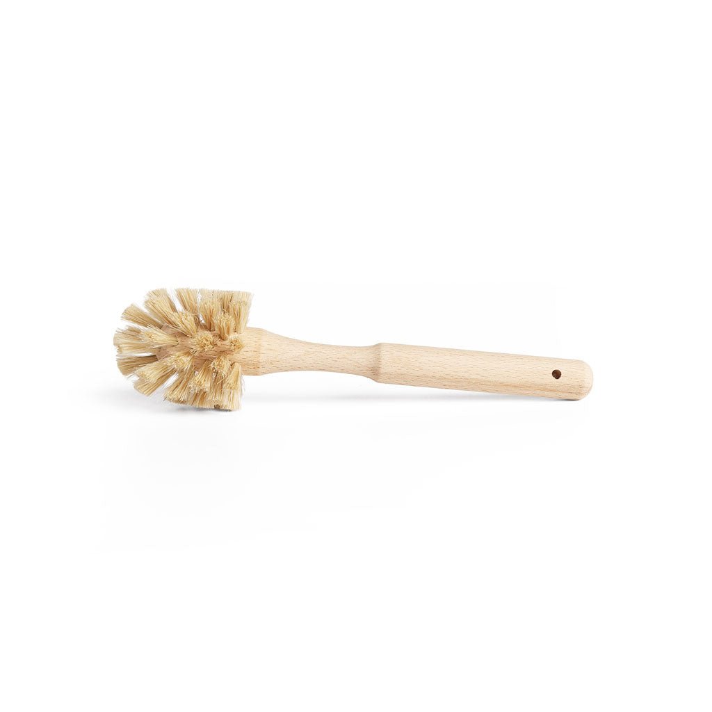 Small wooden demitasse bottle brush with horsehair fibers on white background