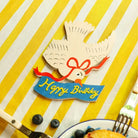 Die-cut bird card with the text happy birthday