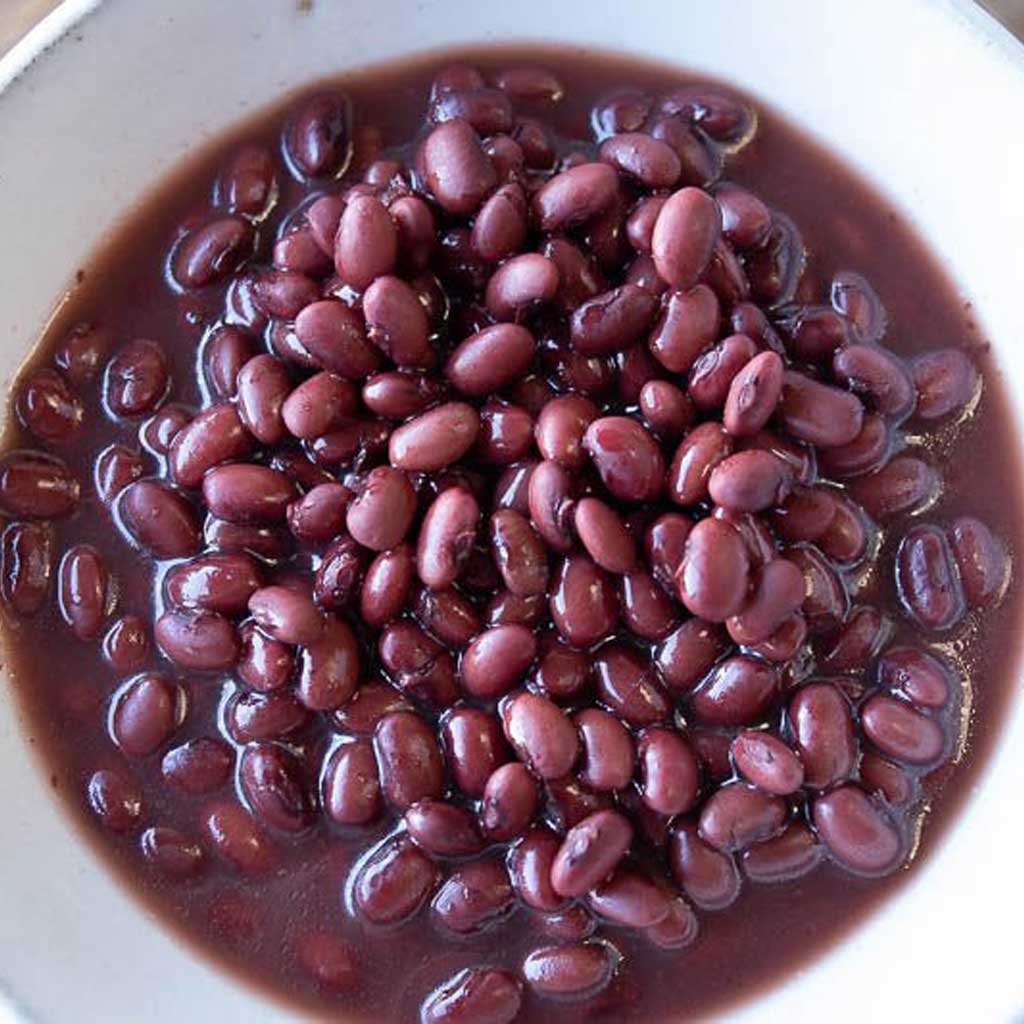 Boiled red beans in a white bowl