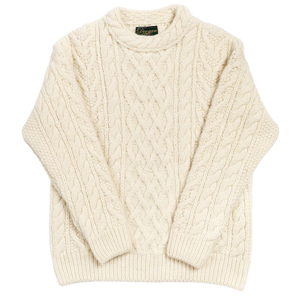 Cream-colored cable knit sweater on a white background