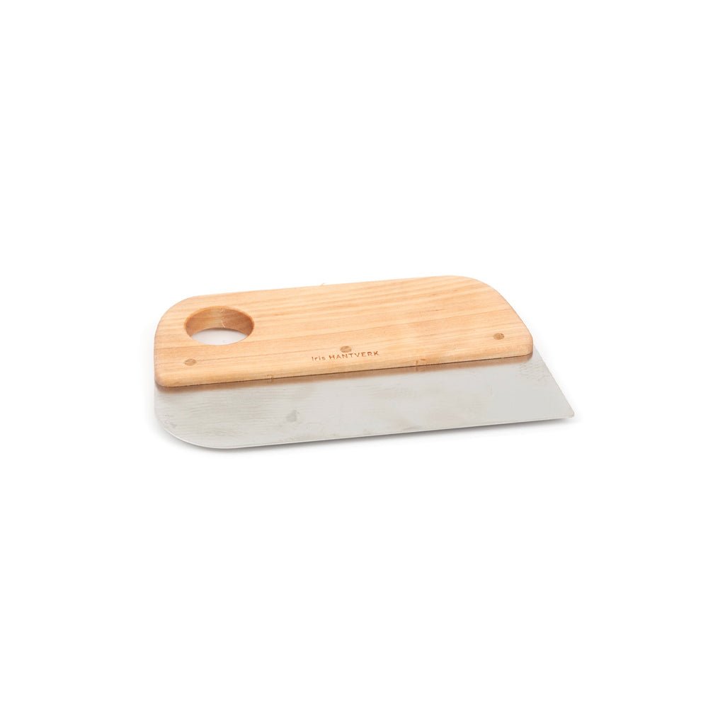 Wooden pastry dough scraper with metal blade on white background