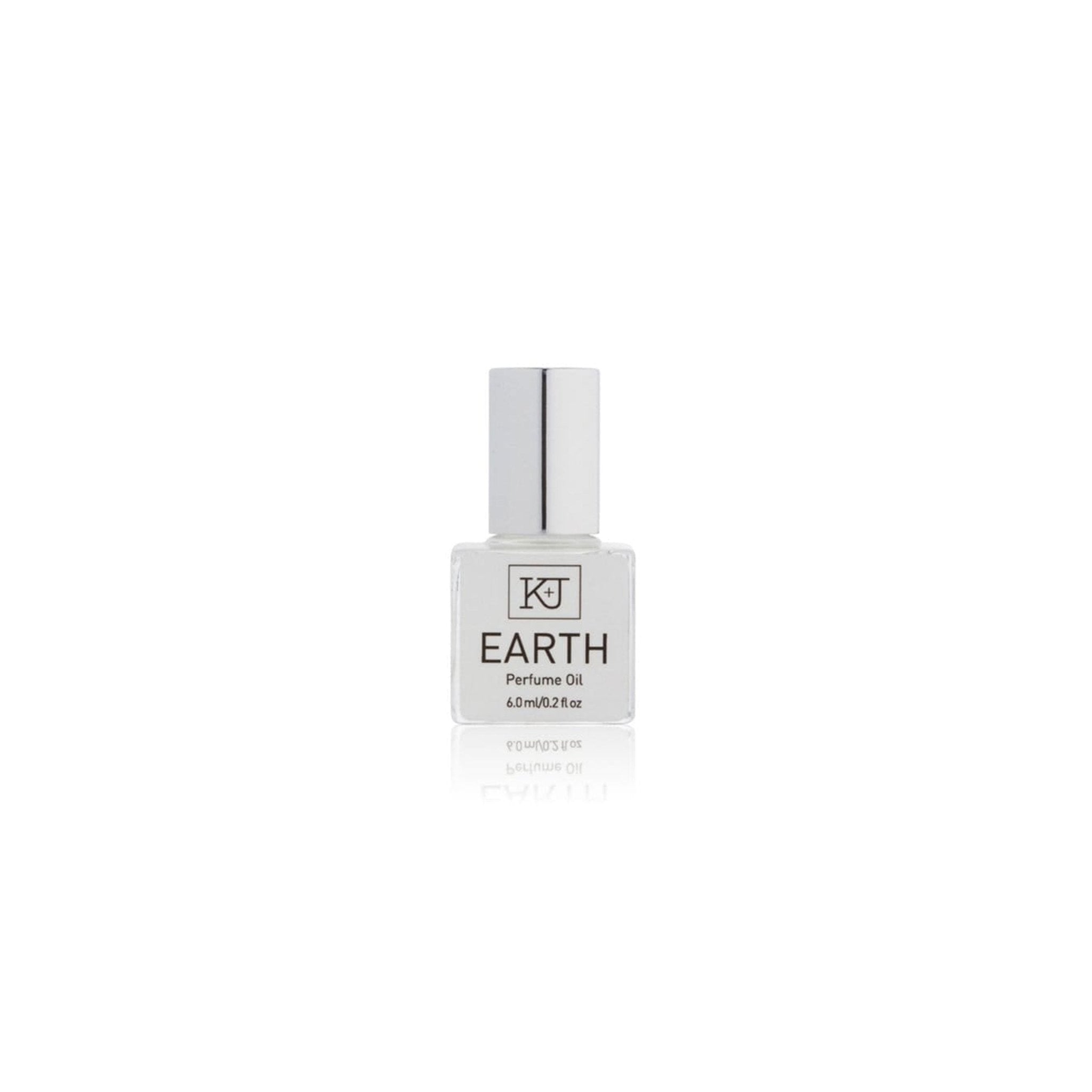 Perfume oil bottle labeled earth on a white background