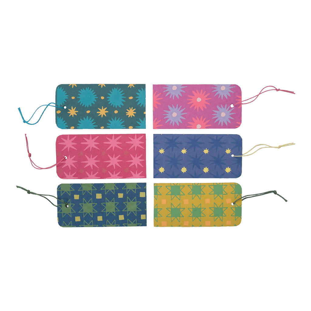 Six patterned, colorful gift tags with strings.