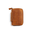 Brown leather zippered wallet on a white background