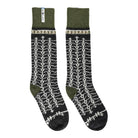 A pair of tall wool socks with a dark charcoal gray base, featuring a white geometric knit pattern and olive green cuffs and heels, displayed against a plain white background.