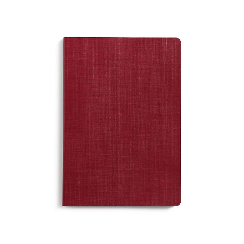 Red notebook on a white background