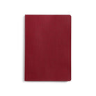 Red notebook on a white background