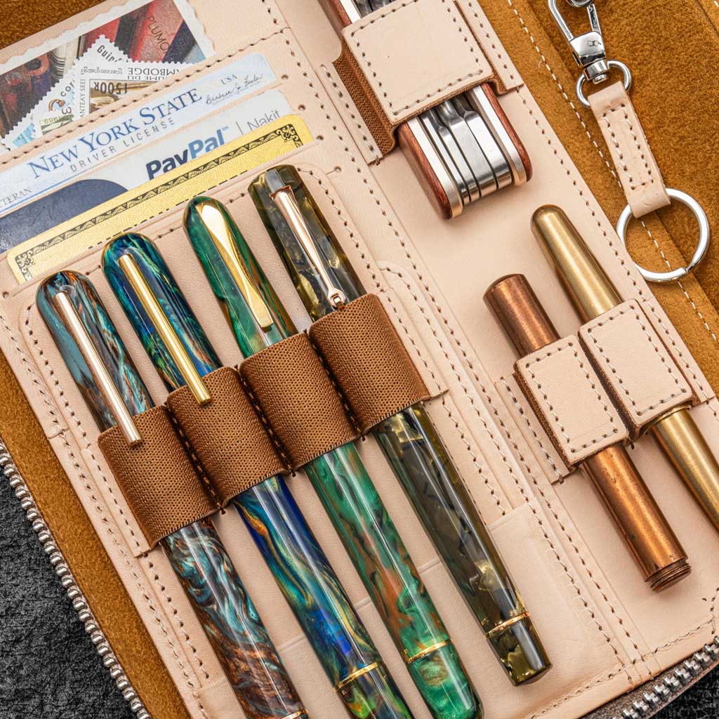 Pens and accessories in undyed leather zippered case