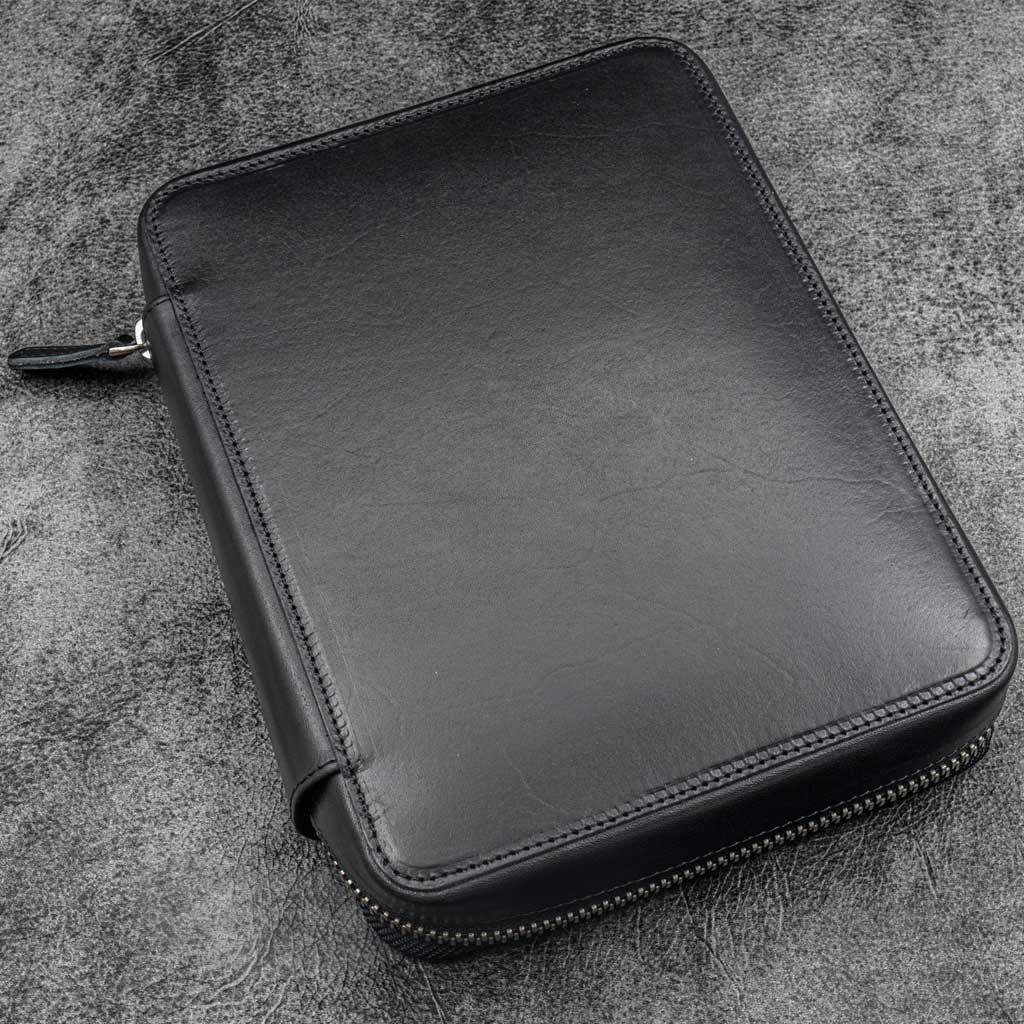 Black leather folio zippered pouch on white background