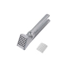 Metal garlic press on a white background
