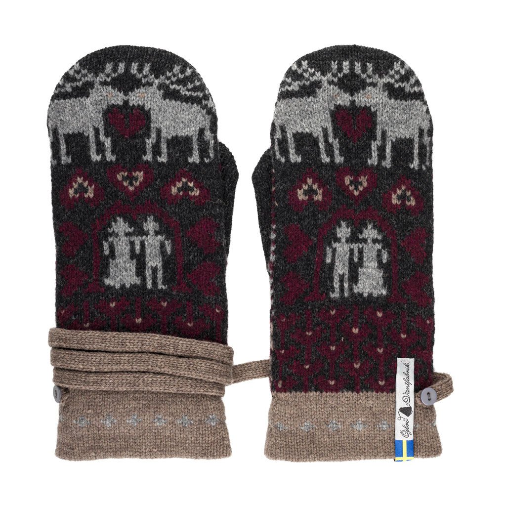 Pair of mittens with reindeer and heart pattern on a white background