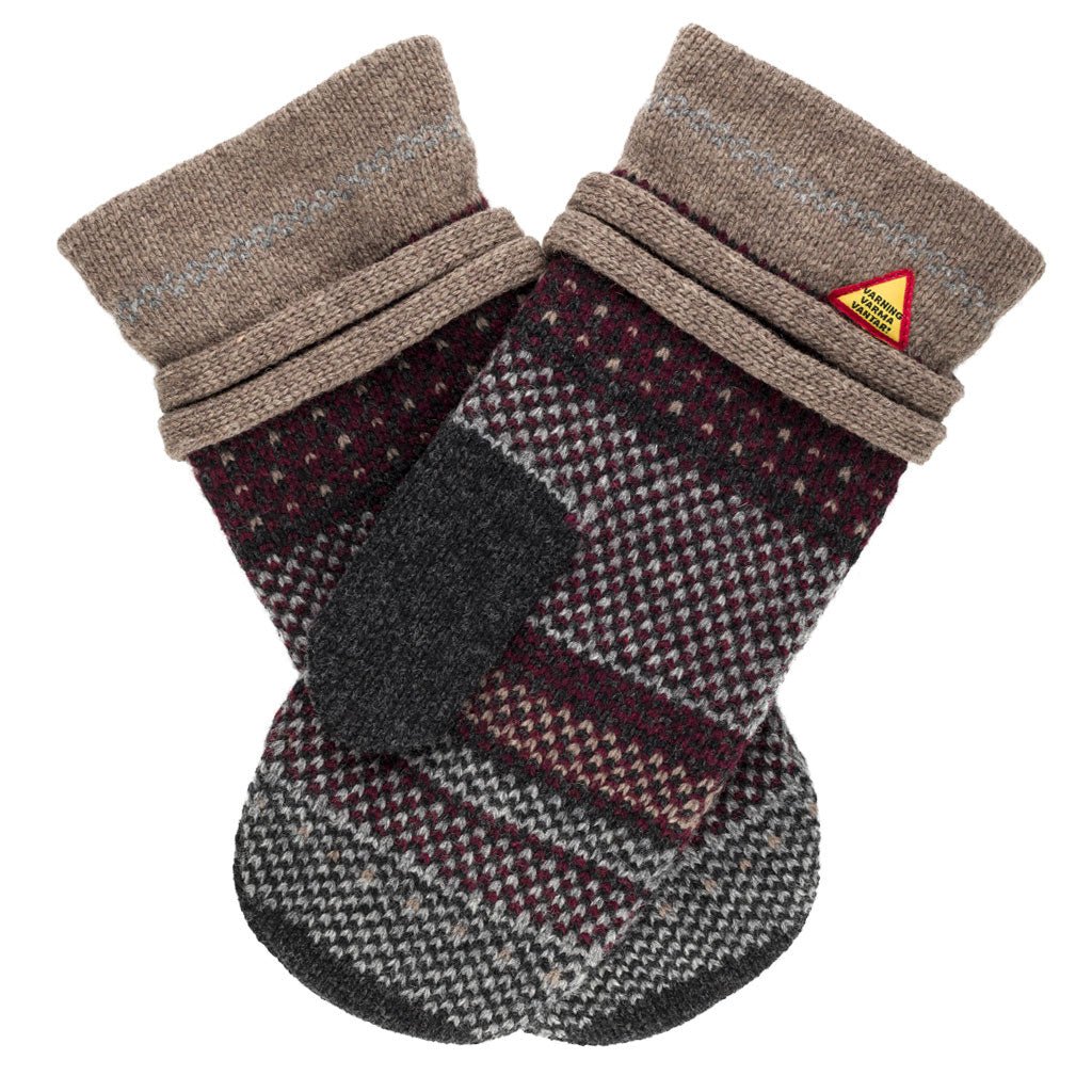 Pair of patterned mittens with a brand label on a white background