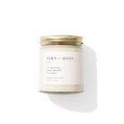 Fern + Moss candle with a white label on a white background