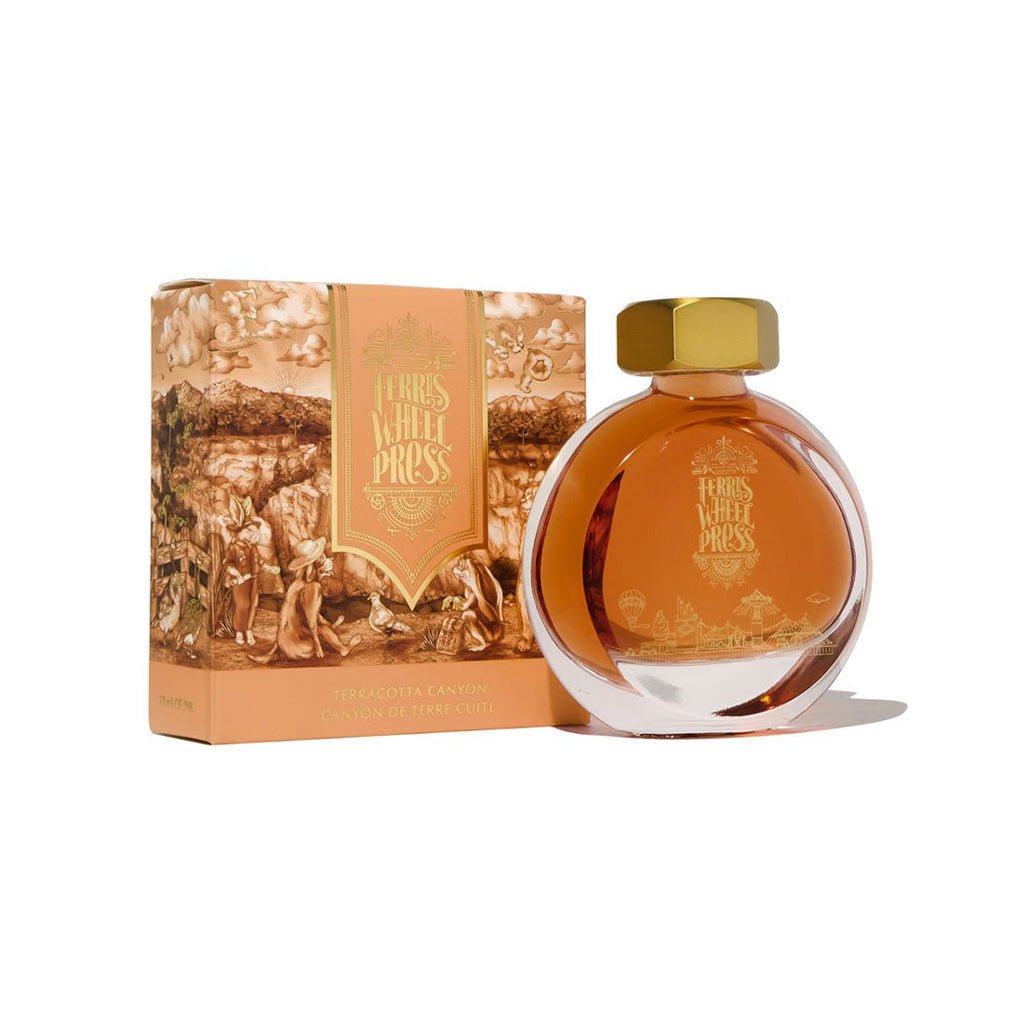 Bottle of Ferris Wheel Press ink with packaging on a white background