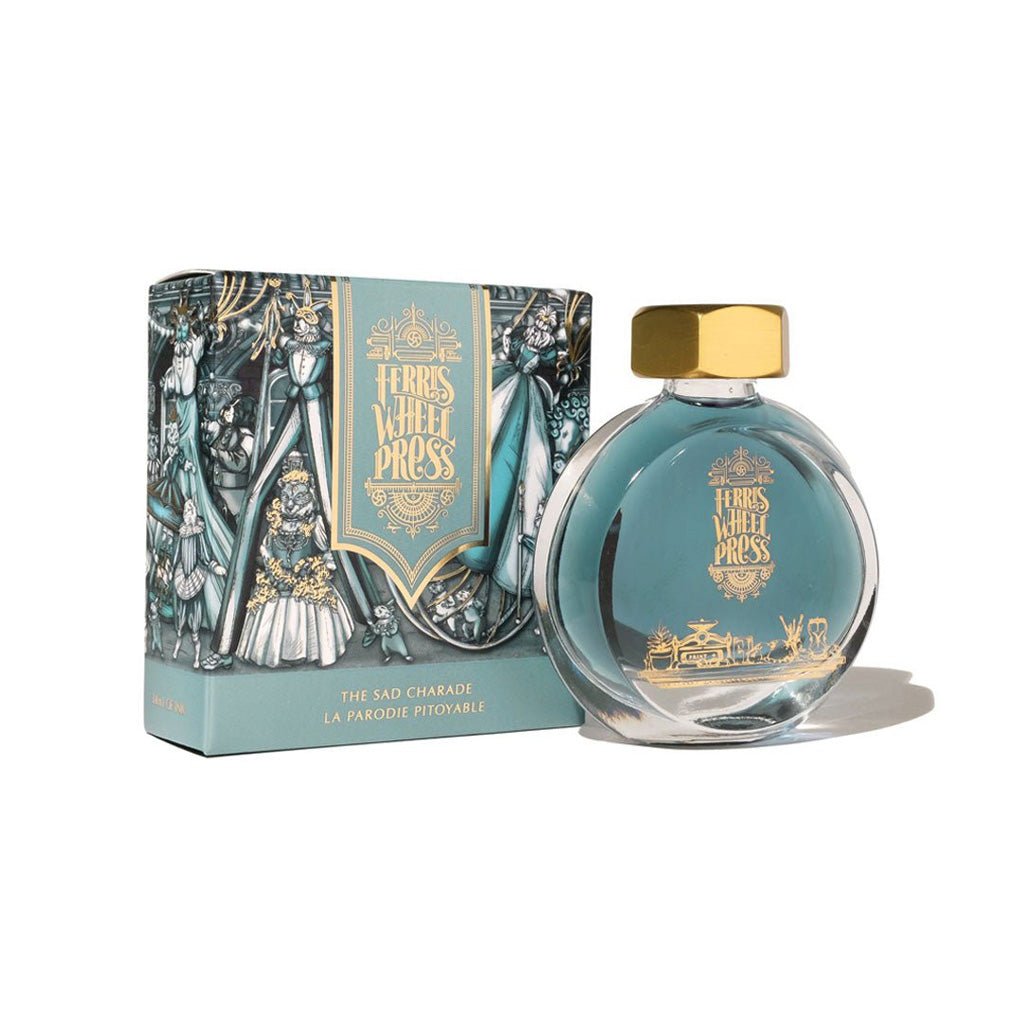 Ink bottle with gold cap and decorative packaging on a white background